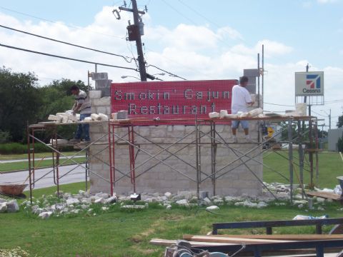 rock work on the sign